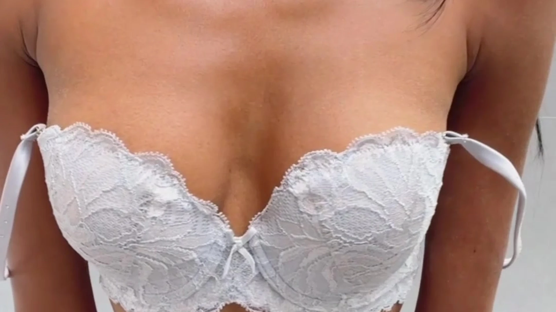 Anna Celeste in a sexy white lingerie teasing with her bra on camera