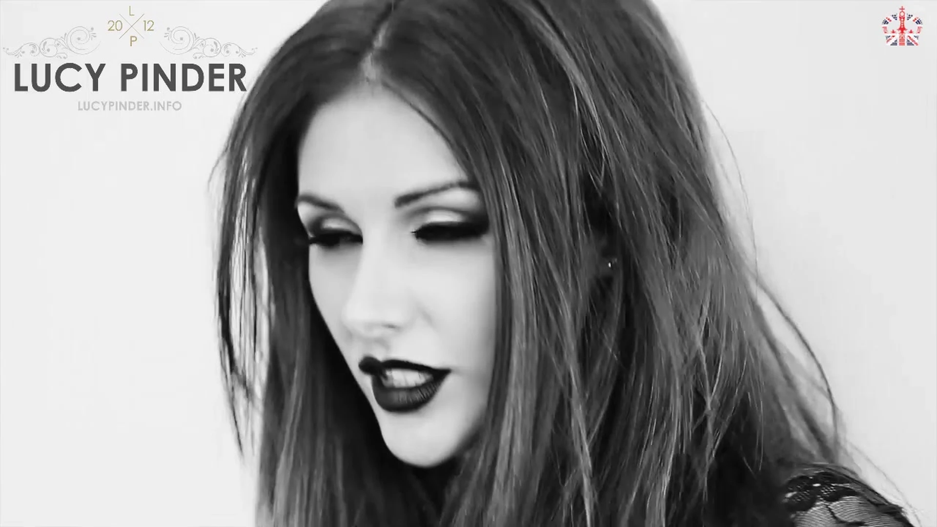 Lucy Pinder opens up her top to show off her big tits on camera