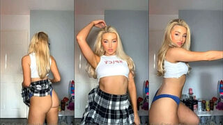 sexy Charlotte Parkes pulling up her skirt to show off her ass