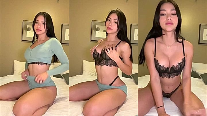 Aishah Sofey removed her cloth leaving only lingerie sitting on the bed