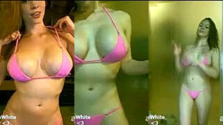 Austin White in a pink sexy lingerie pouring oil on her body