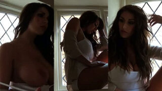 Lucy Pinder stripping her cloth to show off her big tits