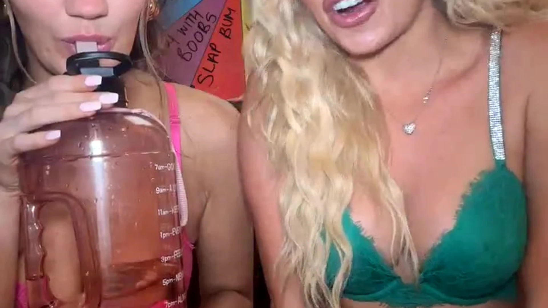 2 onlyfans models in a lingerie playing with sexy spin wheel