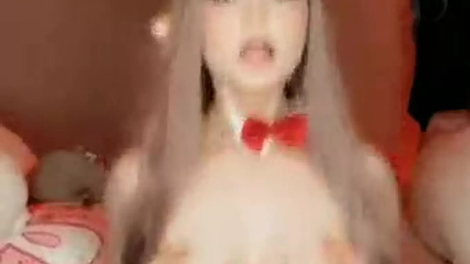 cosplayer Strawbeariemilkk in a costume bouncing on the bell with her tits exposed