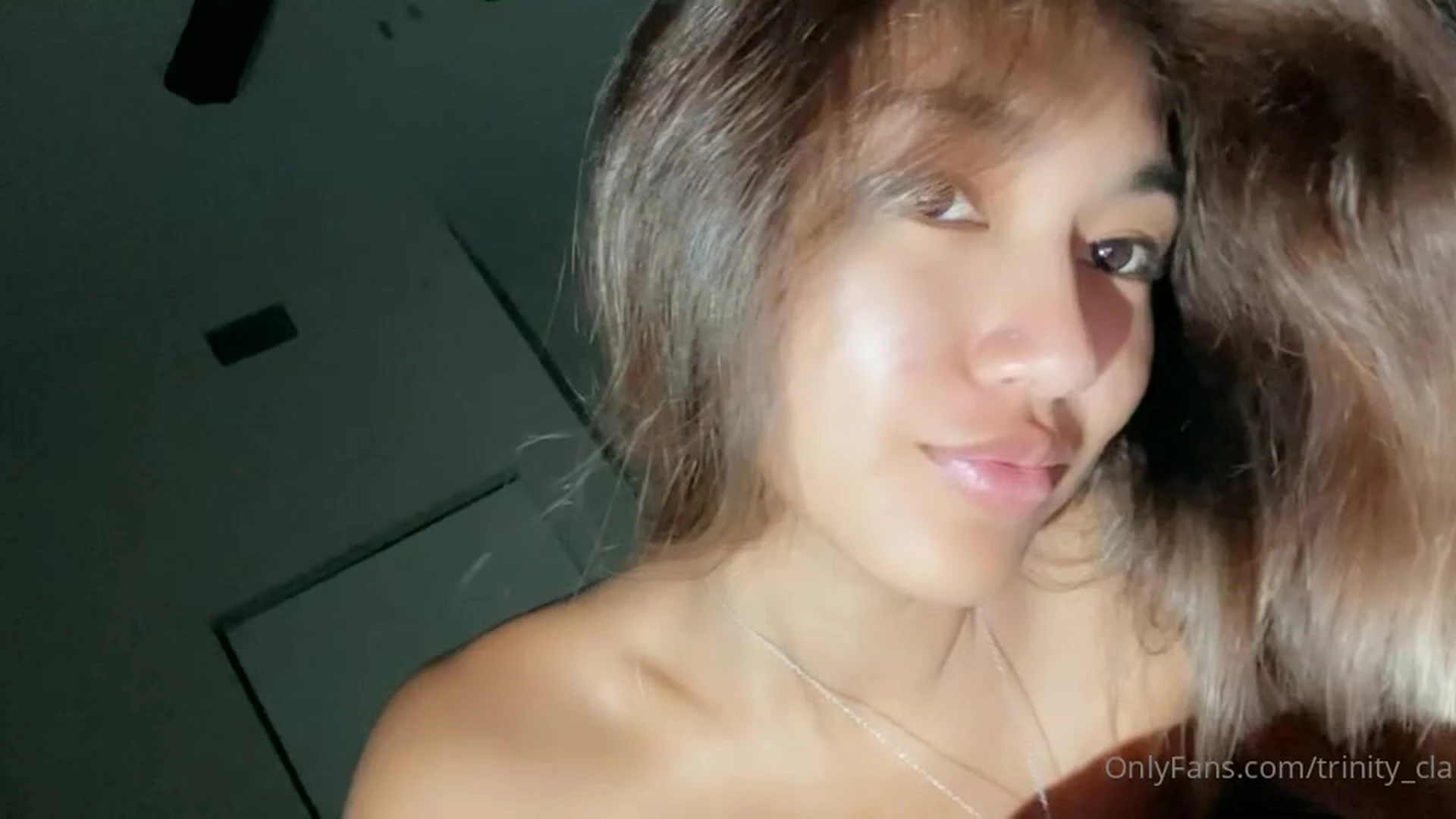 onlyfans clara trinity taking a selfie with her tits exposed